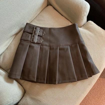 Faux Leather Pleated Mini Skirt With Buckle..