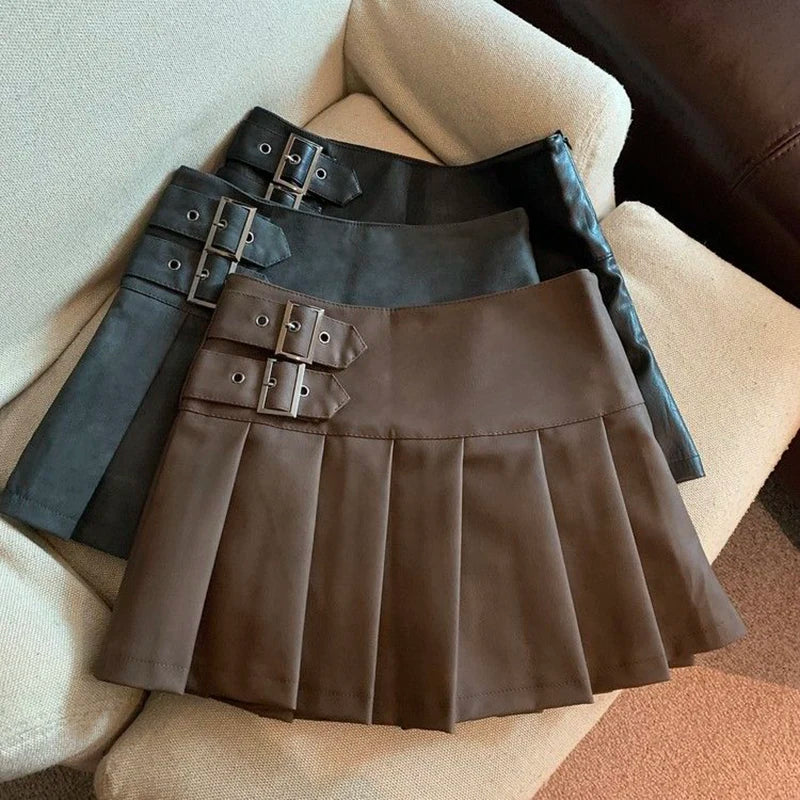 Faux Leather Pleated Mini Skirt With Buckle Details