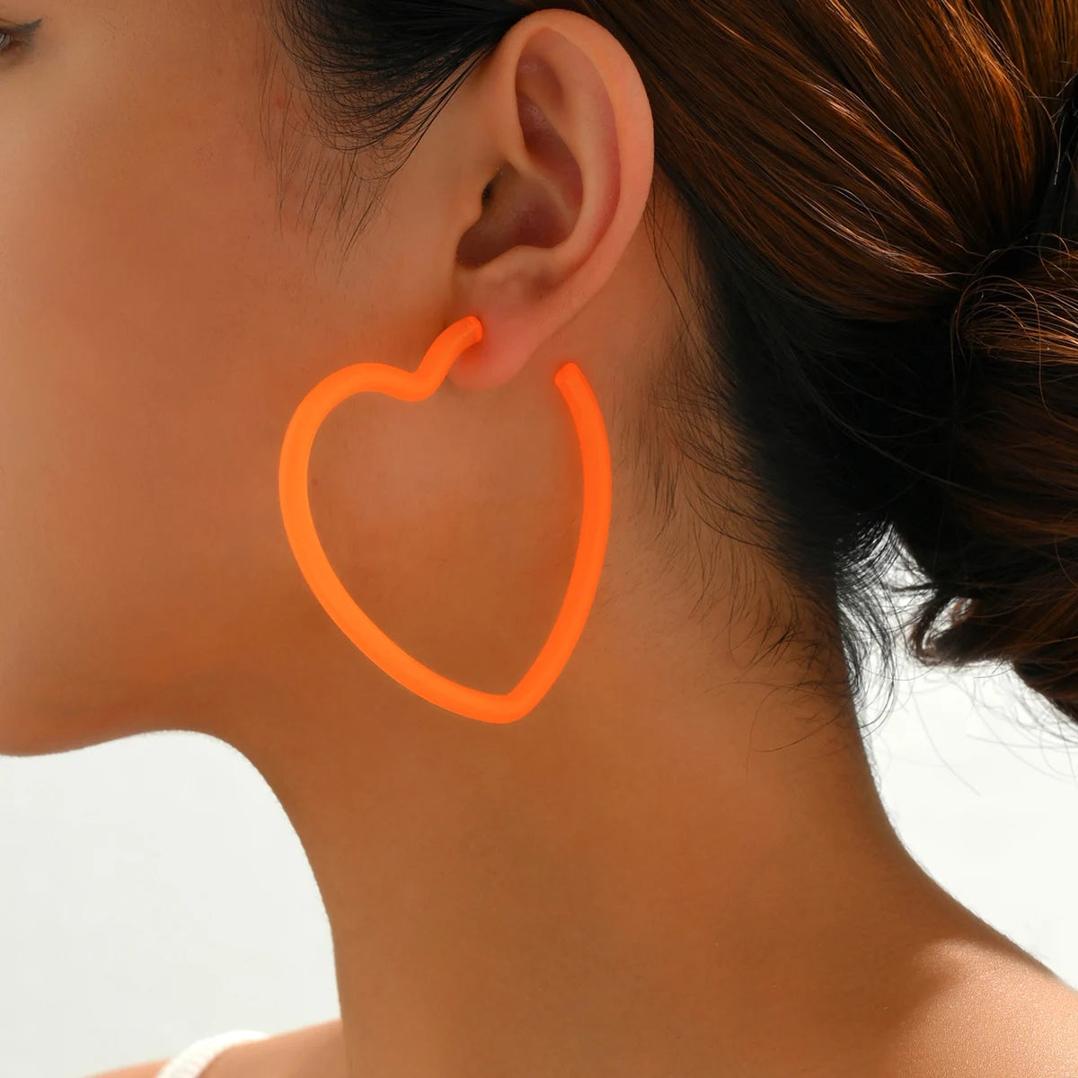Neon orange hoop earrings top